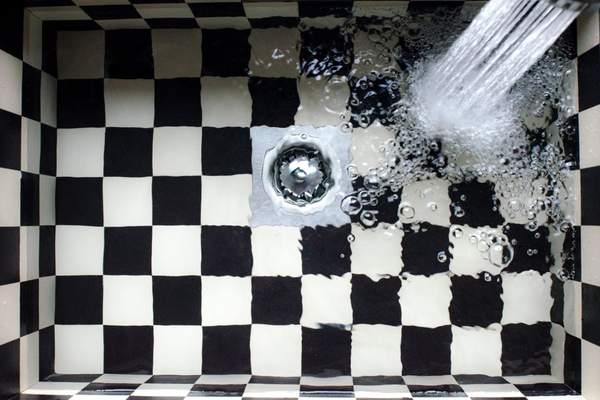 how does a bathroom sink drain work